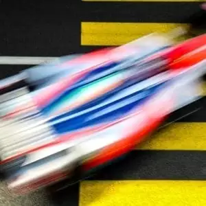 A top picture of a formula e racing car going really fast